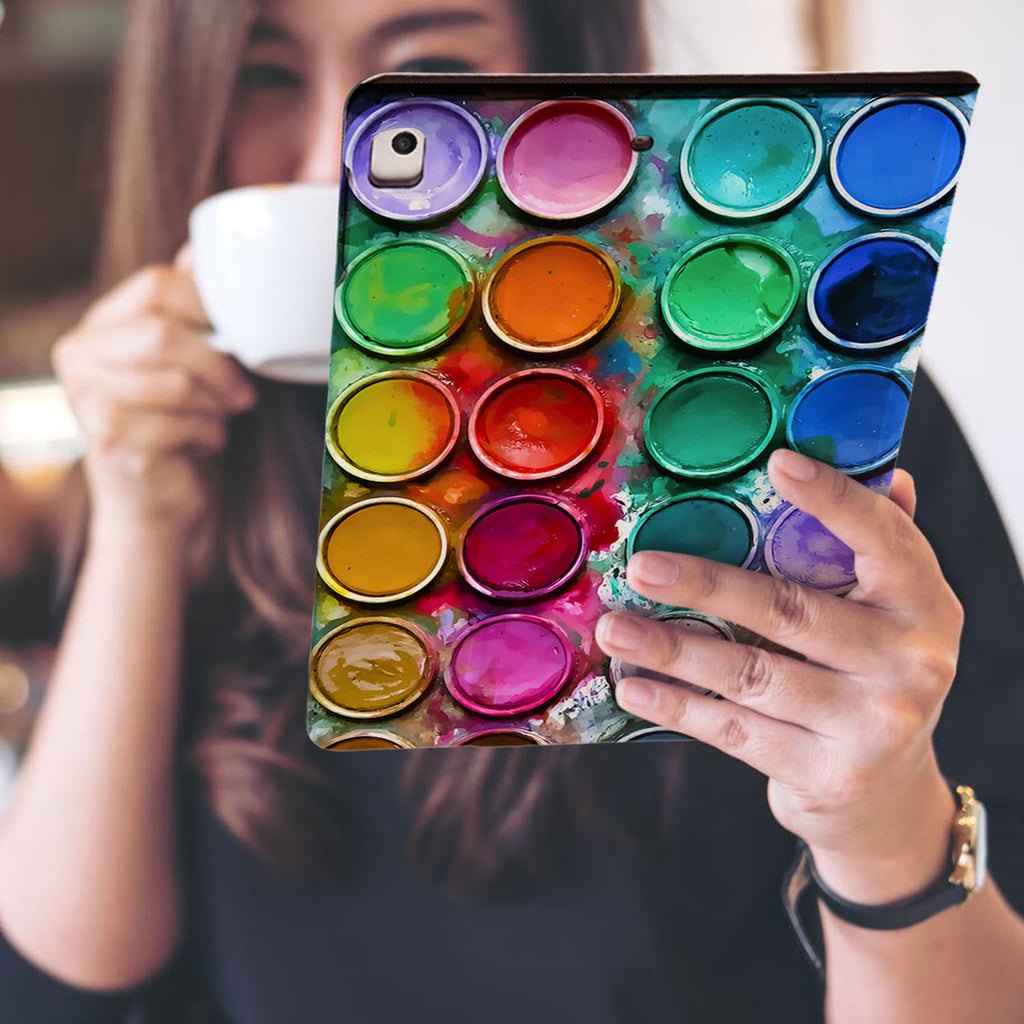 a girl is holding and viewing personalized iPad folio case with Science design