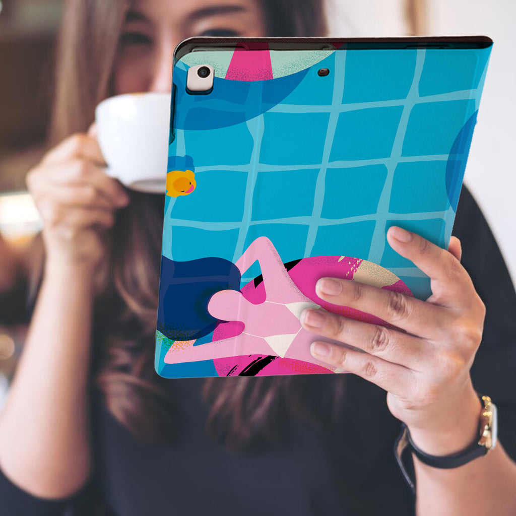 a girl is holding and viewing personalized iPad folio case with Beach design
