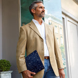 A business man carrying personalized microsoft surface case with Galaxy Universe design in the park