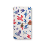 the front top view of midori style traveler's notebook with 4 design